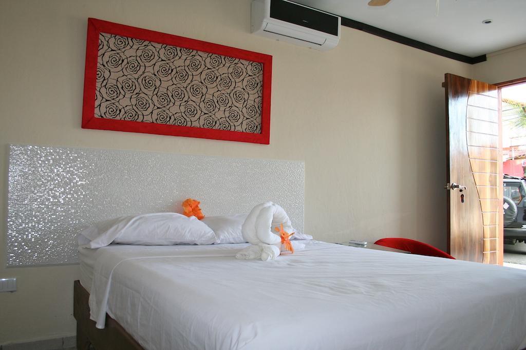 Tuanis Aparthotel Jacó Quarto foto